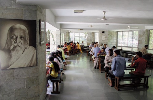 Visitors of Sri Aurobindo Ashram Delhi Branch eating in the dining hall
